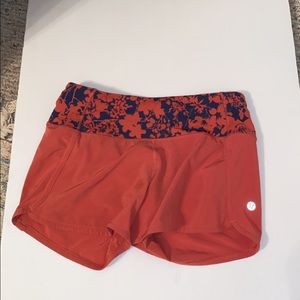 luluemon size 2 coral shorts w flower waste band